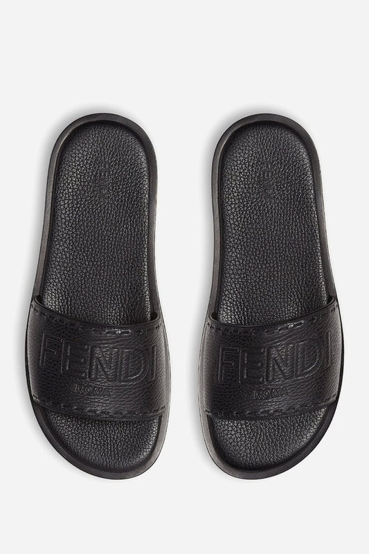 Fendi Roma Embossed Logo Leather Slides in black pebbled leather, top view