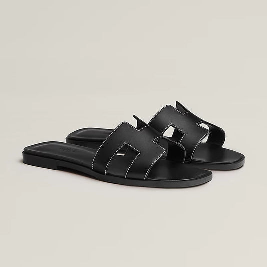Hermès Oran Leather Flat Sandals — Black